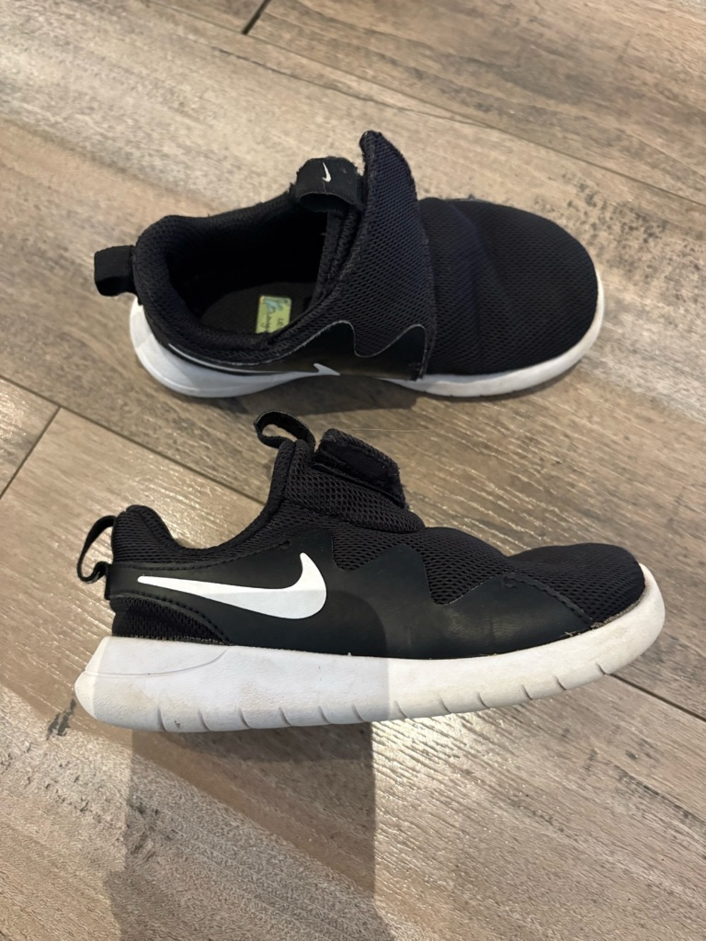 SOLD Nike Kids Black and White Slip-On Athletic Sneakers
